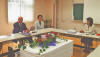 Dr. Hans Koechler, President of the International Progress Organization (left), in a consultation meeting with Mrs. Yumiko Kaneko, Director-General of the Nomura Center for Lifelong Integrated Education (right), at the Center's seminar house in Tokyo. Center: Mrs. Yasuko Ubukata, Director.